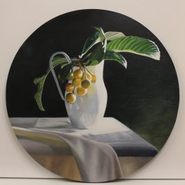 Loquats in white jug